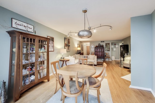 1580 Sherman Ave Unit 1006, Evanston, IL 60201 - dining area with light wood-type flooring, track lighting, and baseboards