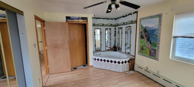 6238 S Kolmar Ave, Chicago, IL 60629 - full bathroom featuring a baseboard heating unit, ceiling fan, wood finished floors, and a garden tub