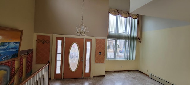 6238 S Kolmar Ave, Chicago, IL 60629 - foyer entrance with a baseboard heating unit, a towering ceiling, a chandelier, and baseboards