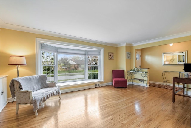 1212 S Greenwood Ave, Park Ridge, IL 60068 - sitting room featuring crown molding, light wood-type flooring, and baseboards