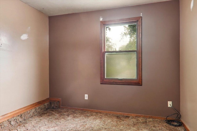 1212 Colton Ave, Bloomington, IL 61701 - spare room featuring carpet flooring and baseboards