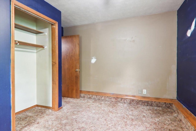 1212 Colton Ave, Bloomington, IL 61701 - unfurnished bedroom with carpet floors, baseboards, and a closet