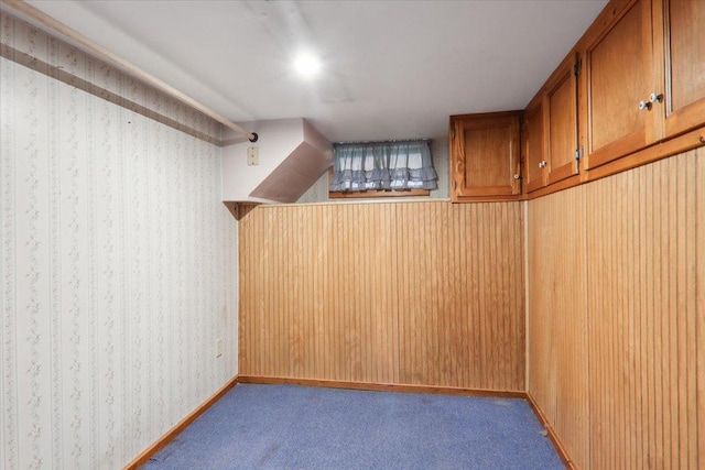 1212 Colton Ave, Bloomington, IL 61701 - below grade area featuring wallpapered walls and dark carpet