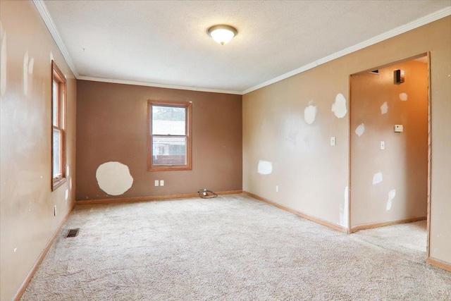 1212 Colton Ave, Bloomington, IL 61701 - spare room with carpet flooring, crown molding, and baseboards