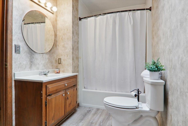 1212 Colton Ave, Bloomington, IL 61701 - full bath featuring toilet, wood finished floors, vanity, and shower / bathtub combination with curtain