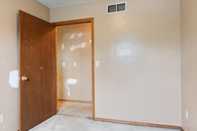 1212 Colton Ave, Bloomington, IL 61701 - carpeted empty room featuring baseboards