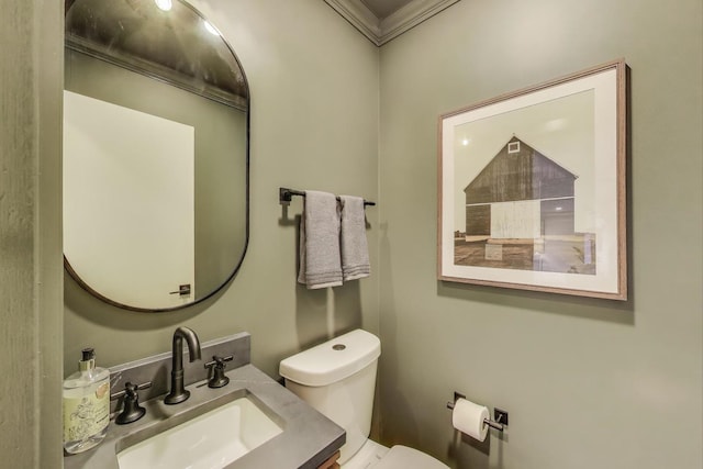 502 S William St, Mount Prospect, IL 60056 - bathroom featuring a sink, toilet, and crown molding