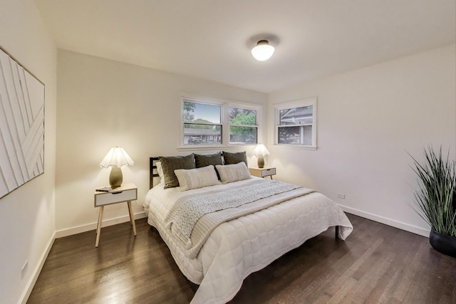 502 S William St, Mount Prospect, IL 60056 - bedroom featuring dark wood-style flooring and baseboards