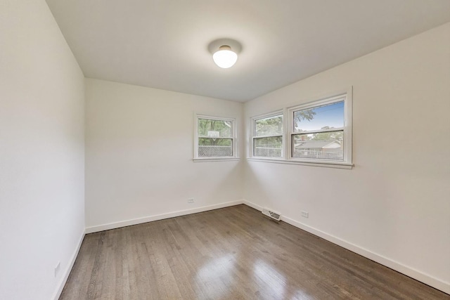502 S William St, Mount Prospect, IL 60056 - spare room featuring dark wood-style floors and baseboards