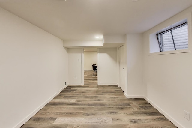 502 S William St, Mount Prospect, IL 60056 - below grade area with wood finished floors, baseboards, and recessed lighting