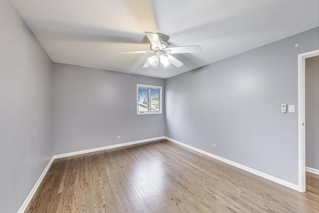 654 N Robinson Dr, Palatine, IL 60074 - unfurnished room with a ceiling fan, wood finished floors, and baseboards