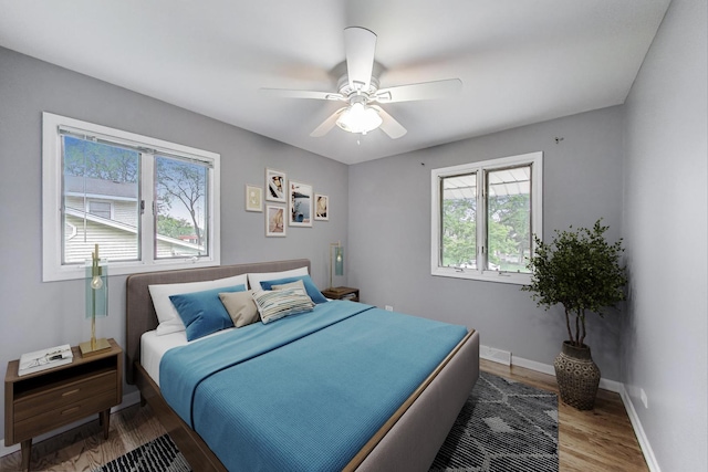 654 N Robinson Dr, Palatine, IL 60074 - bedroom featuring wood finished floors, baseboards, and a ceiling fan