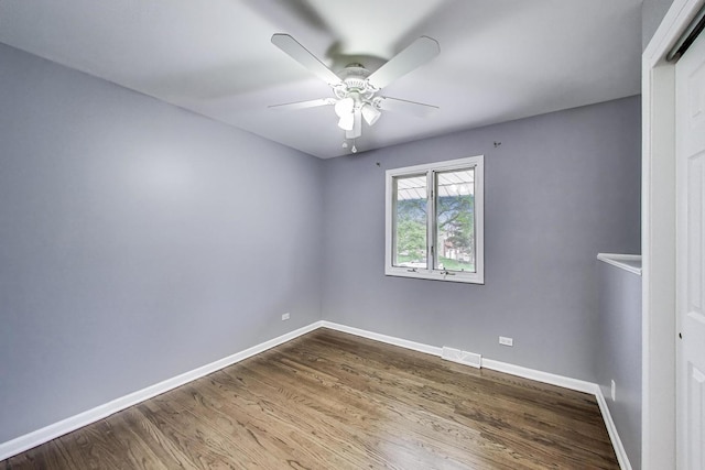 654 N Robinson Dr, Palatine, IL 60074 - unfurnished room featuring dark wood-style flooring, a ceiling fan, and baseboards