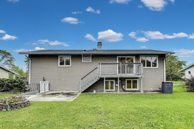654 N Robinson Dr, Palatine, IL 60074 - back of property with central AC, a patio area, a wooden deck, and a lawn