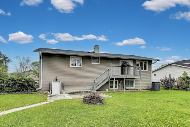 654 N Robinson Dr, Palatine, IL 60074 - back of property with a wooden deck, stairway, cooling unit, a yard, and a fire pit