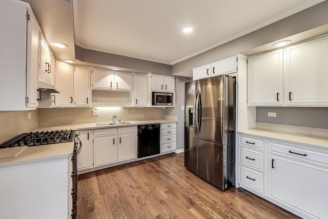 654 N Robinson Dr, Palatine, IL 60074 - kitchen featuring stainless steel appliances, a sink, ornamental molding, recessed lighting, and white cabinetry