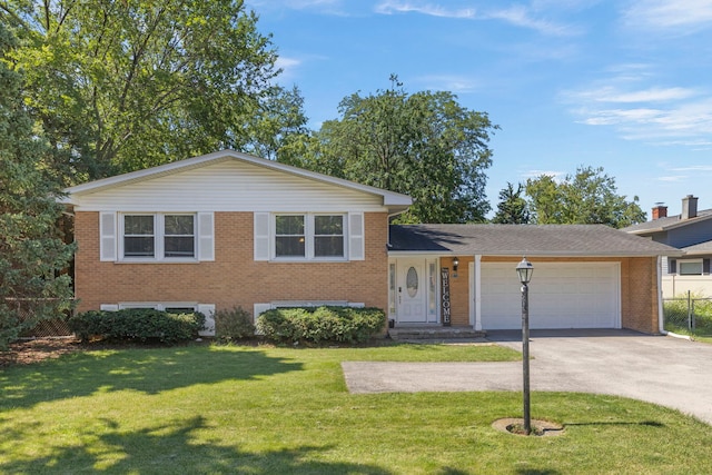 573 Maple Ave, Lisle, IL 60532 - tri-level home with brick siding, an attached garage, and driveway