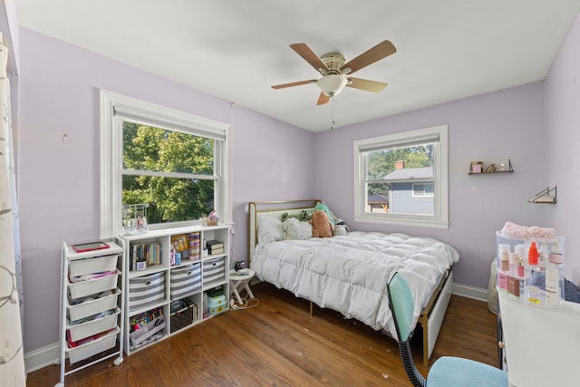 573 Maple Ave, Lisle, IL 60532 - bedroom with multiple windows, wood finished floors, baseboards, and ceiling fan