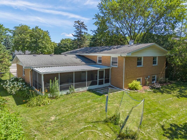 573 Maple Ave, Lisle, IL 60532 - rear view of property with a sunroom, a yard, and brick siding