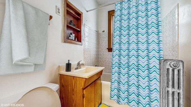 7360 N Damen Ave Unit 1S, Chicago, IL 60645 - full bath featuring vanity, toilet, radiator, and shower / bathtub combination with curtain