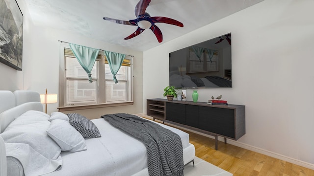 7360 N Damen Ave Unit 1S, Chicago, IL 60645 - bedroom featuring wood finished floors, baseboards, and ceiling fan
