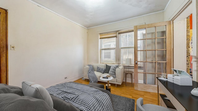 7360 N Damen Ave Unit 1S, Chicago, IL 60645 - bedroom featuring ornamental molding, wood finished floors, and baseboards
