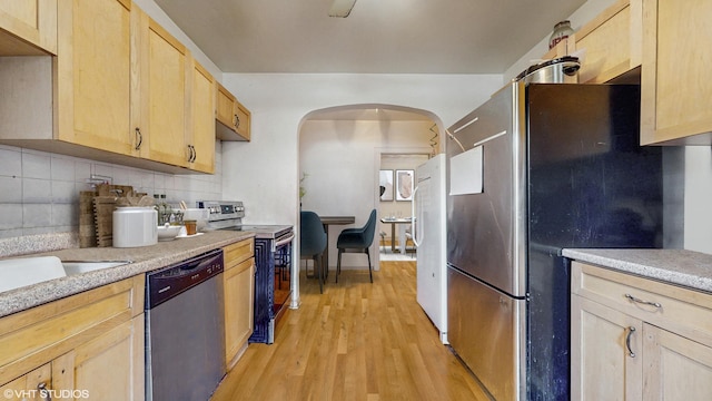 7360 N Damen Ave Unit 1S, Chicago, IL 60645 - kitchen featuring stainless steel appliances, light brown cabinets, light wood finished floors, tasteful backsplash, and light countertops