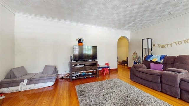 7360 N Damen Ave Unit 1S, Chicago, IL 60645 - living area with arched walkways, hardwood / wood-style floors, crown molding, and baseboards