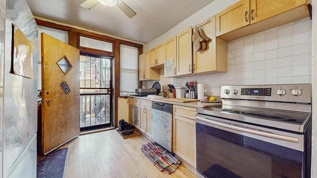 7360 N Damen Ave Unit 1S, Chicago, IL 60645 - kitchen featuring appliances with stainless steel finishes, a sink, light wood-style flooring, light brown cabinets, and a ceiling fan