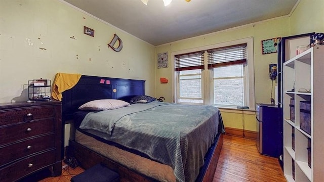 7360 N Damen Ave Unit 1S, Chicago, IL 60645 - bedroom featuring wood finished floors, crown molding, and baseboards