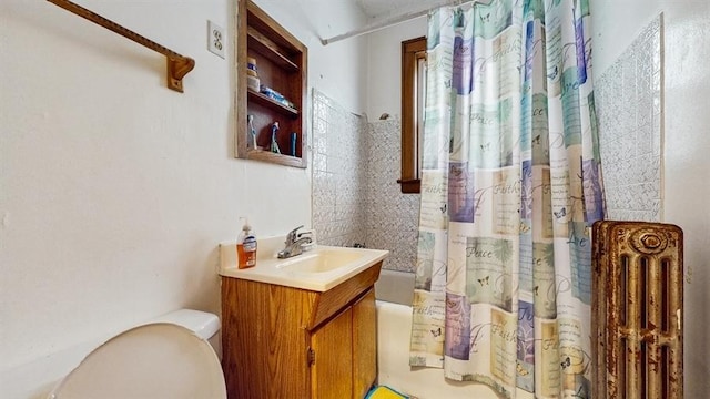 7360 N Damen Ave Unit 1S, Chicago, IL 60645 - bathroom with toilet, vanity, shower / bath combination with curtain, and radiator heating unit