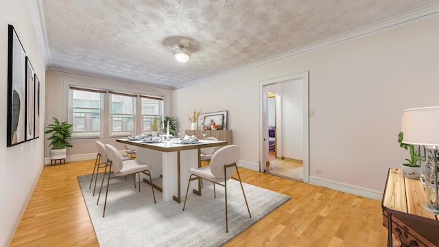 7360 N Damen Ave Unit 1S, Chicago, IL 60645 - dining space featuring light wood-style flooring, crown molding, and baseboards