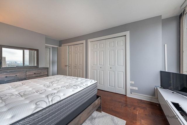 5455 N Sheridan Rd Unit 3006, Chicago, IL 60640 - bedroom featuring multiple closets, dark wood-type flooring, and baseboards