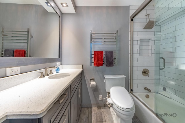 5455 N Sheridan Rd Unit 3006, Chicago, IL 60640 - bathroom featuring toilet, vanity, wood finished floors, and a towel warmer