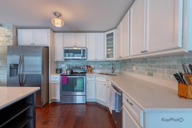 5455 N Sheridan Rd Unit 3006, Chicago, IL 60640 - kitchen with appliances with stainless steel finishes, a sink, dark wood-style floors, and white cabinetry