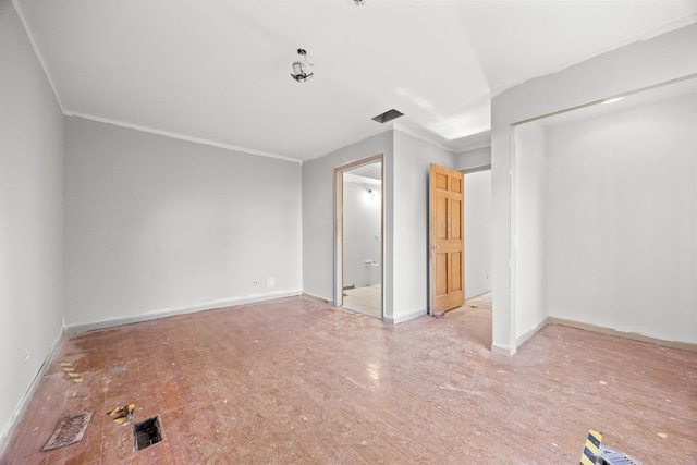 1315 Loral Ave, Joliet, IL 60435 - unfurnished bedroom featuring ornamental molding, a closet, baseboards, and wood finished floors