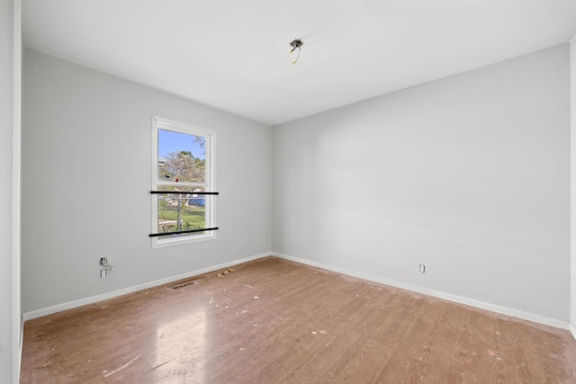 1315 Loral Ave, Joliet, IL 60435 - spare room featuring wood finished floors and baseboards