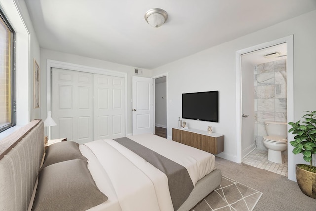 2109 N Harlem Ave Unit 3A, Chicago, IL 60707 - bedroom featuring a closet, carpet, baseboards, and ensuite bathroom