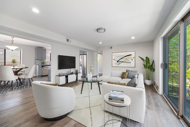 2109 N Harlem Ave Unit 3A, Chicago, IL 60707 - living room featuring light wood-type flooring and recessed lighting