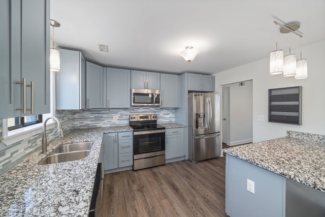 2109 N Harlem Ave Unit 3A, Chicago, IL 60707 - kitchen featuring appliances with stainless steel finishes, a sink, decorative backsplash, and light stone counters