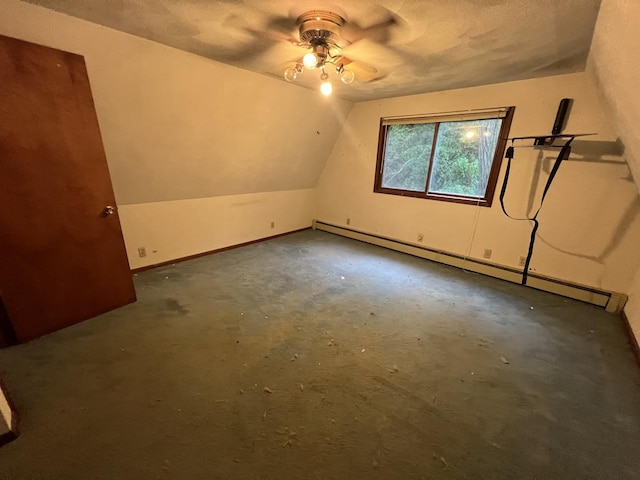 307 Northern Oaks Dr, Groveland, IL 61535 - additional living space with a baseboard heating unit, a ceiling fan, vaulted ceiling, and baseboards