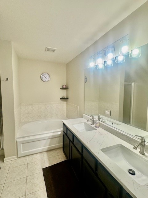 1676 Fredericksburg Ln, Aurora, IL 60503 - full bathroom featuring tile patterned floors, a bath, double vanity, and a stall shower