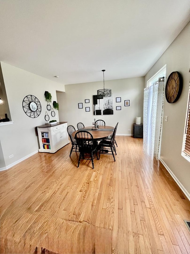 1676 Fredericksburg Ln, Aurora, IL 60503 - dining room with light wood-type flooring and baseboards