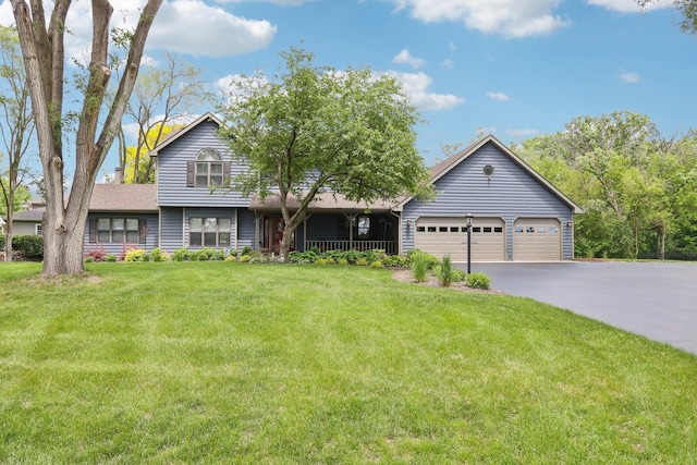 2902 Pleasant Dr, Mchenry, IL 60051 - view of front of home with a front lawn, driveway, and a garage
