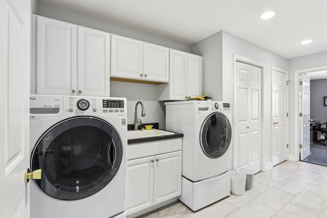 2902 Pleasant Dr, Mchenry, IL 60051 - washroom with separate washer and dryer, cabinet space, recessed lighting, and light marble finish floors