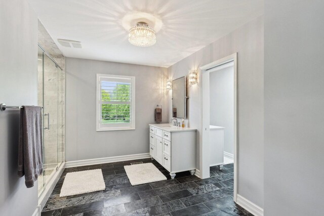 2902 Pleasant Dr, Mchenry, IL 60051 - full bathroom featuring vanity, a stall shower, baseboards, and stone finish floors