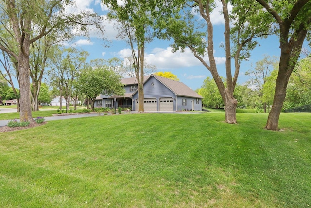 2902 Pleasant Dr, Mchenry, IL 60051 - view of front facade featuring a garage and a front yard