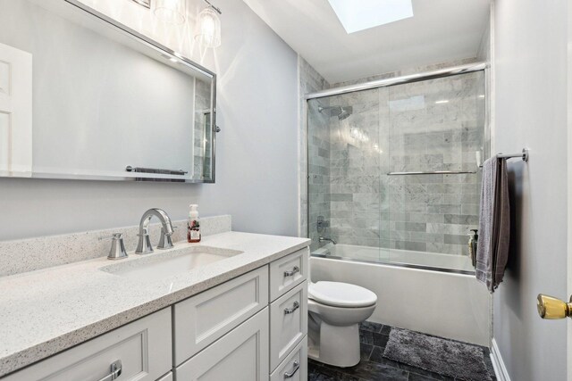 2902 Pleasant Dr, Mchenry, IL 60051 - full bath featuring vanity, toilet, shower / bath combination with glass door, and a skylight