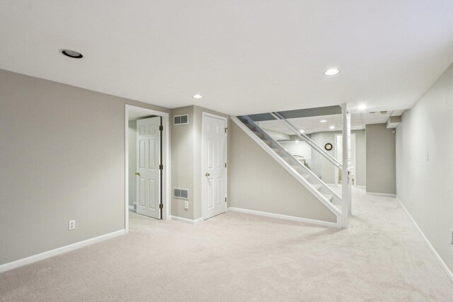2902 Pleasant Dr, Mchenry, IL 60051 - finished below grade area with light carpet, recessed lighting, baseboards, and stairs