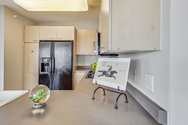 1720 Maple Ave Unit 1270, Evanston, IL 60201 - kitchen with black appliances, light countertops, and a textured ceiling